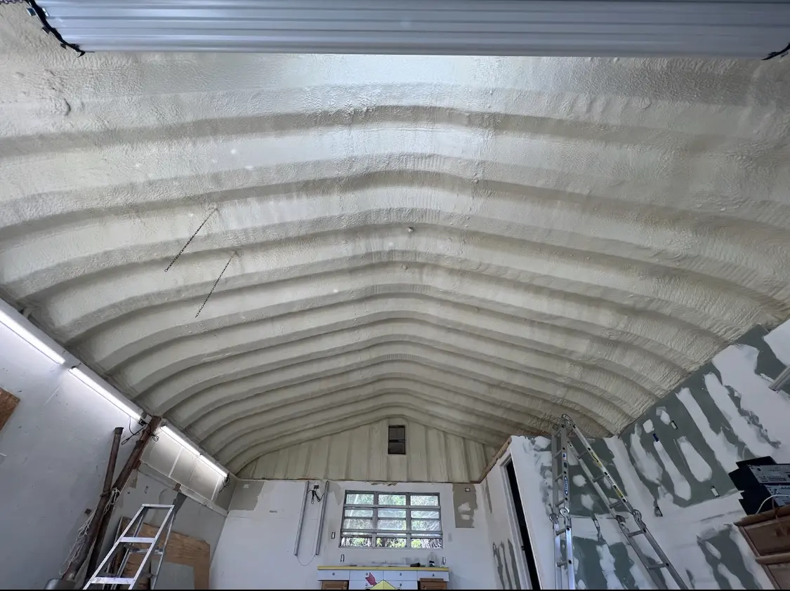 Spray polyurethane foam applied to the underside of a metal roof deck in Fort Edward